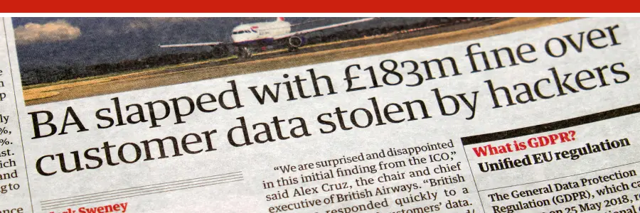 The news headline that reads 'BA slapped with £183m fine over customer data stolen by hacker'